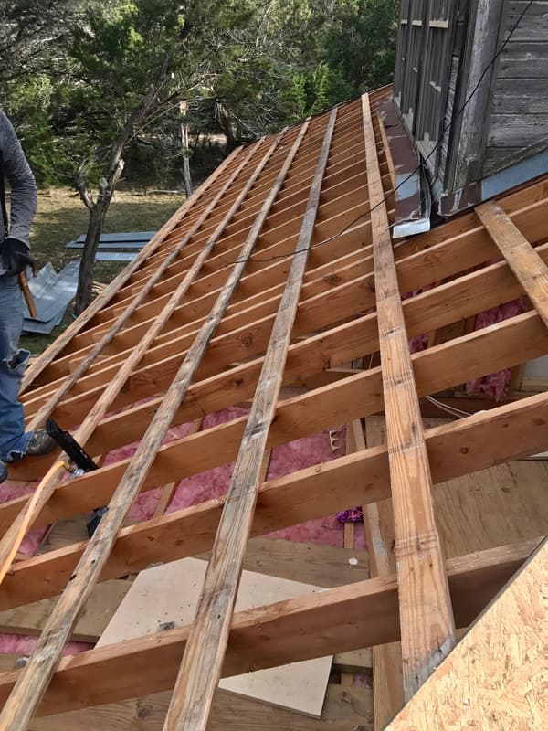 Professional roofers working on a residential home in San Antonio TX